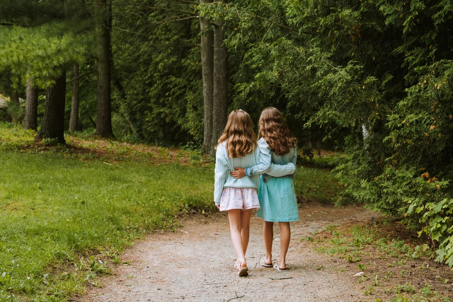 Jon Christensen's daughters walking together in a Guelph park
