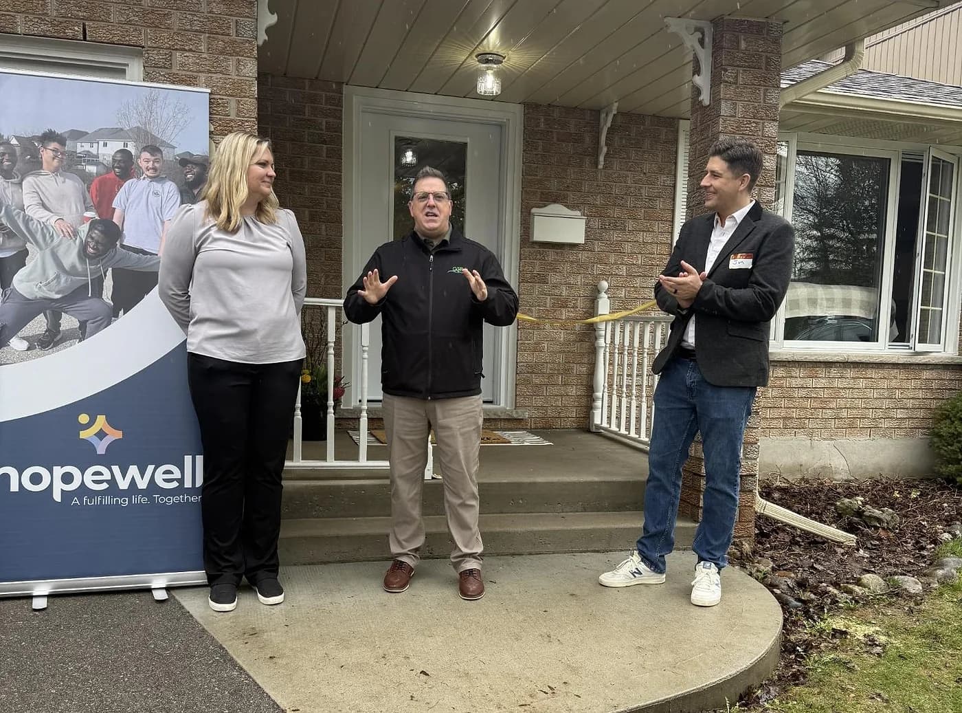 A Hopewell Support Services home opening, with Jon Christensen and Hopewell staff outside the new home